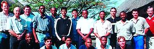 The techtour group of students; (on the left) are: Technikon staff Carl Reinecke and Gary van Vuuren, and John Crossland is on the extreme right of the group